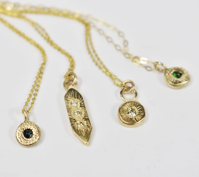 Diamond and gold circle pendant