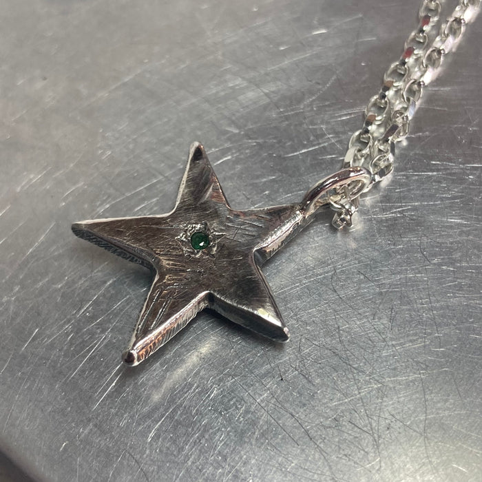 Sterling star pendant with emerald