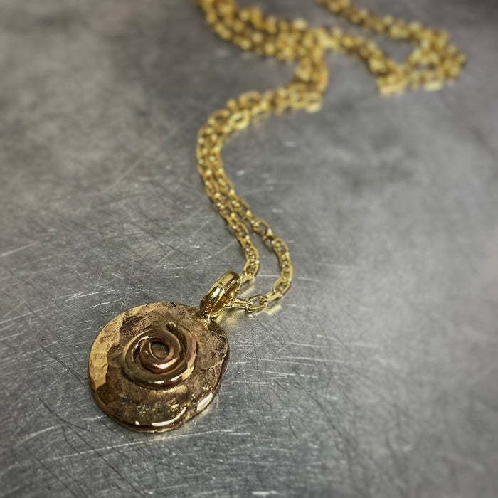 Gold spiral pendant