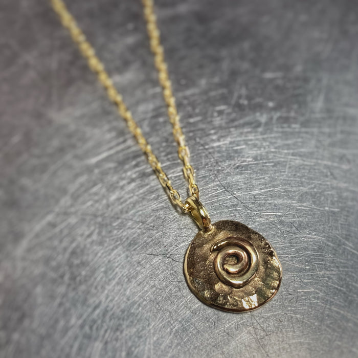 Gold spiral pendant