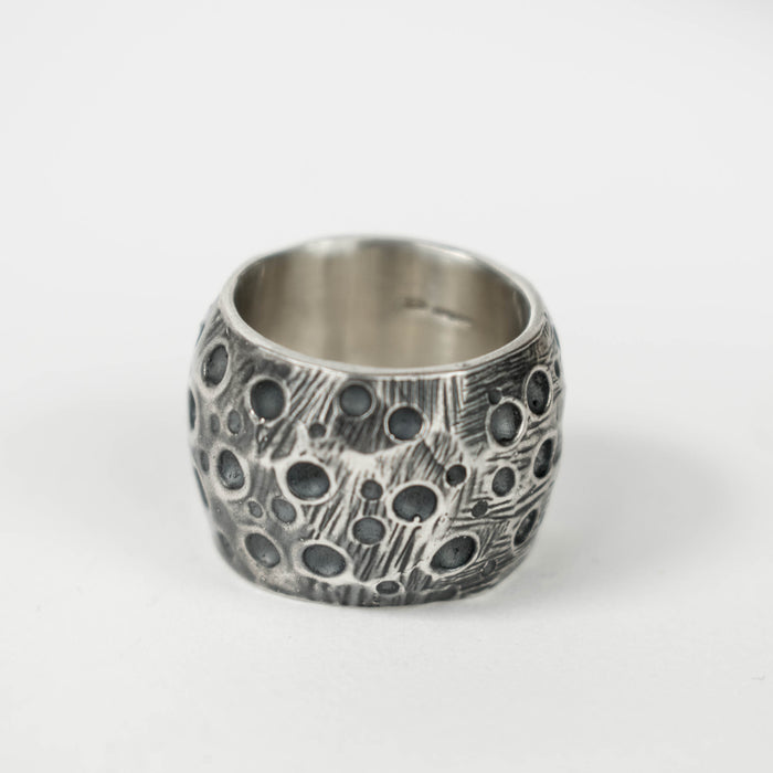 Wide silver crater ring